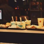 Healthy fast food meal with grilled chicken sandwich, fresh vegetables, and fruit cup, showing nutritious options at fast food restaurants.